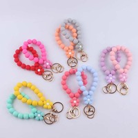 Porte-clés de perles rondes en silicone pour femme avec bracelet élastique coloré de fleur et pendentif à breloque de sac cadeau imprimé UV