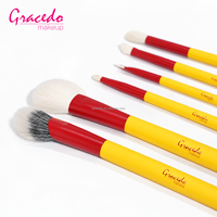 Ensemble de pinceaux de maquillage professionnel Gracedo 10 pièces, étui cylindrique en cuir jaune, poignée rouge, pinceau à raser, pinceau pour fond de teint et poudre