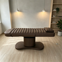 Lit de massage électrique côtelé marron chocolat avec base sur pieds réglable pour spa et salon de soins corporels