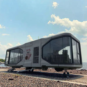 Maison moderne préfabriquée à deux étages Conception efficace de l'espace terrestre avec pièce supplémentaire au-dessus du garage pour les petites villes Maisons de roulottes - Product Image 1