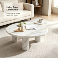 Table basse de luxe en marbre blanc. Table basse élégante en pierre naturelle ronde avec pieds cylindriques pour la décoration moderne du salon.