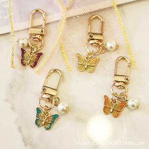 2020 Creative Alliage Papillon Perle Pendentif Sac Décoration Téléphone Cas De Voiture Porte-clés - Product Image 1