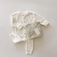 Combinaison bébé en coton biologique côtelé, boutonnée, à manches longues, unisexe, vêtements en tricot pour nourrissons, combinaison personnalisée OEM