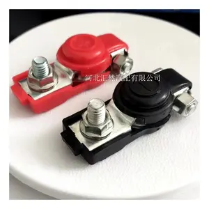 Car battery terminals with a pair of red and black plastic covers
