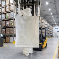 Sac FIBC tubulaire en PP de 1000 kg avec quatre boucles de levage sans soudure et bec de décharge pour le chargement et le déchargement automatisé de minerai dans les silos