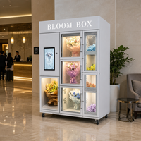 Vitrine de présentation de bouquets blanc-gris avec compartiments en verre et écran tactile pour distributeur automatique de fleurs