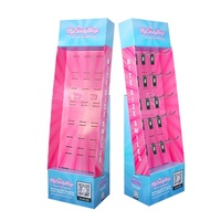 Présentoir de sol en carton rose moderne et écologique, personnalisé, avec crochets et étagères en forme d'aile, en carton ondulé, pour bandes de bonbons acidulés