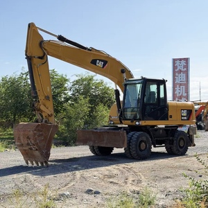 รถขุดล้อยาง CAT M320 มือสอง Caterpillar M320 น้ำหนัก 21 ตัน พร้อมเครื่องยนต์ C4.4 Stage V หัวต่อแบบ Quick Coupler ขาตั้งแบบ Outrigger สำหรับงานถนนในเขตเทศบาล - Product Image 1