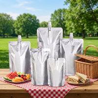 Pochettes souples personnalisées en aluminium imprimées par gravure avec bec verseur pour jus et lait – Réutilisables, transparentes, avec buse de distribution