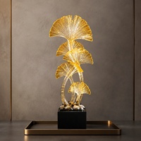 Sculpture de table haute en résine dorée style Art déco, feuille de Ginkgo, sur base noire, pour l'entrée ou la décoration du salon