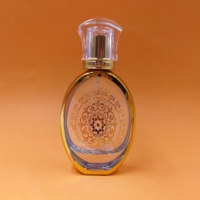 Flacon de parfum rond en verre doré de luxe de haute qualité 50 ml avec diffuseur à bâtonnets, bouchon à vis, gravure et sérigraphie, livraison rapide