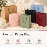 Sac en papier de luxe personnalisé avec ruban, finition colorée et poignée stratifiée brillante, poignée avec impression artistique et soufflet latéral, pour cadeaux et fêtes