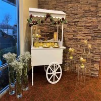 Chariot mobile cylindrique 2026 en promotion pour fleurs, bonbons et chocolats, présentoir sur roulettes