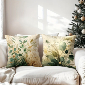 수채화 식물 그림이 그려진 장식 쿠션은 아늑한 소파를 장식하고, 배경에는 축제 분위기의 양말과 사슴 뿔이 있습니다. - Product Image 3