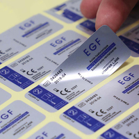 Autocollant personnalisé en polyester brillant ou mat argenté pour l'impression d'étiquettes de logo sur emballages de bouteilles d'équipements électroniques