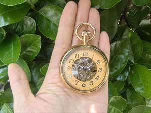 Montre de poche mécanique vintage en or jaune, boîtier rond, mouvement visible - Product Image 2