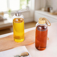 Bouteille d'eau en verre borosilicate transparente de luxe avec logo personnalisé et couvercle en verre hermétique – Meilleure vente