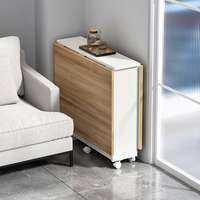 Ensemble de table à manger moderne compact et multifonctionnel avec pieds en fer et chaises en bois sur roulettes, design pliable et gain de place