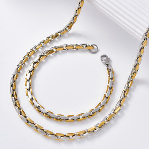 Ensemble collier et bracelet élégant en acier inoxydable plaqué or 18 carats, anti-ternissement, robuste, avec chaîne segmentée double teinte brillante, vente en gros - Product Image 1