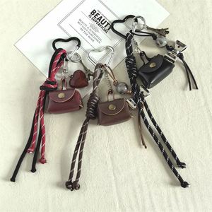 Hot-selling Instagram-style Cute Style <b>Leather</b> Mini Bag <b>Keychain</b> Niche Pendant Creative Schoolbag Wholesale - Product Image 1
