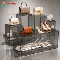 Présentoir en acrylique transparent OEM ODM, ensemble de supports surélevés en plexiglas pour bijoux, chaussures, sacs à main, cosmétiques et montres en magasin de détail