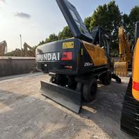 Excavatrice sur pneus d'occasion HYUNDAI 210W-9T de haute qualité et à prix abordable pour la construction routière