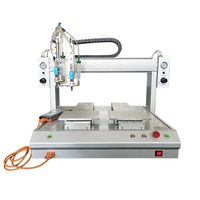 Machine de distribution entièrement automatique à double tête et deux stations pour seringues de colle époxy, UV et thermofusible avec fonction de revêtement et de goutte-à-goutte