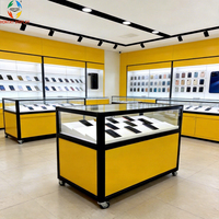 Vitrine de kiosque téléphonique minimaliste moderne pour centre commercial, avec éclairage LED, dos en verre, en aluminium, écologique, personnalisable, pour conception complète de magasin