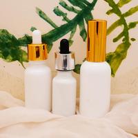 Bouteilles vides en verre de porcelaine blanche de 30ml 1Oz avec le chapeau d'or