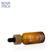 Flacons compte-gouttes en bambou respectueux de l'environnement boston 1oz 2oz 4oz flacon d'huile corporelle en verre ambré flacon d'huile essentielle compte-gouttes en bambou