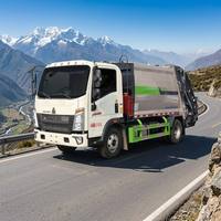 Camion compacteur à chargement arrière SINOTRUK HOWO 4x2 Diesel à compression hydraulique pour la collecte des déchets municipaux