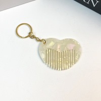 Peigne et porte-clés miniatures en acétate faits à la main en forme de cœur, accessoire de mode avec texture haut de gamme et peigne à franges portable pour sac