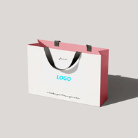 Sac cadeau personnalisé boutique de luxe emballage de parfum petit sac en papier noir pour bijoux de mariage avec poignée