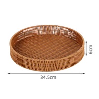 Panier de rangement rond tissé en rotin Plateau de nourriture domestique Panier en rotin multi-modèle personnalisé