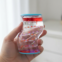 Nouvelle bouteille apaisante et relaxante en forme de S à mouvement liquide pour le soulagement de l'anxiété, idéale pour les besoins sensoriels spéciaux et la décoration de la maison ou du bureau