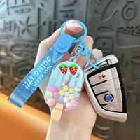 Porte-clés et breloque de sac en forme de bonbon flottant dans l'huile, motif fraise glacée