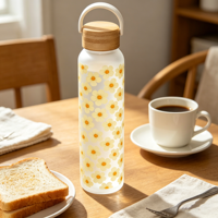 Bouteille en verre écologique de 550 ml avec surface en silicone douce au toucher et design personnalisé imprimé sur toute la surface