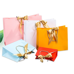 <span class=keywords><strong>Sac</strong></span> en papier <span class=keywords><strong>kraft</strong></span> <span class=keywords><strong>personnalisé</strong></span> de luxe avec nœud papillon imprimé, estampage à chaud, pour cadeaux de <span class=keywords><strong>mariage</strong></span>, bijoux, cosmétiques, <span class=keywords><strong>sac</strong></span> de shopping avec logo en ruban - Product Image 1