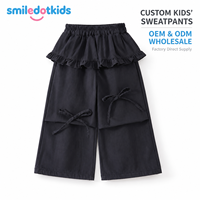 Smiledotkids Pantalon de survêtement personnalisé pour enfants, noir, taille à volants, nœud, poche, coupe large, OEM ODM, direct usine, vente en gros pour tout-petits