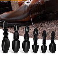 Embauchoirs en plastique noir réglables anti-plis avec logo personnalisé, support de chaussures télescopique à ressort en PE