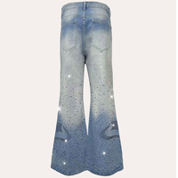 Pantalon en jean délavé et vieilli à coupe ample et jambe large, taille mi-haute, avec étiquette personnalisée, strass et détails usés, vente en gros
