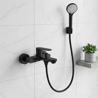 Ensemble de douche mural rond en laiton noir avec douchette à main et cartouche céramique pour hôtels et villas, idéal pour baignoire et robinetterie de salle de bain