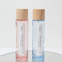 Flacon de parfum en verre noir et rose de luxe de forme ronde de 30 ml, 50 ml, 100 ml avec vaporisateur à fine brume