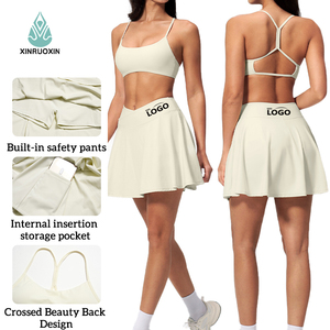 Ensemble de sport 2 pièces pour <span class=keywords><strong>femme</strong></span> : Jupe-<span class=keywords><strong>short</strong></span> de tennis <span class=keywords><strong>avec</strong></span> soutien-gorge de sport dos croisé <span class=keywords><strong>intégré</strong></span> et <span class=keywords><strong>short</strong></span> <span class=keywords><strong>avec</strong></span> poche, idéal pour le yoga et la course à pied - Product Image 1
