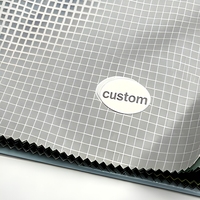 Tissu en nylon imperméable 3000MM 10D*10D 510T 30GSM à grille de 0,15 cm, enduit PU d'un côté et silicone de l'autre, pour abri de pluie