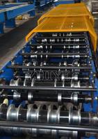 Machine de formage à froid de tôles ondulées en zinc pour toitures et murs