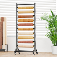 Support d'affichage métallique multifonctionnel personnalisable de style moderne pour rouleaux de tapis et tissus noirs