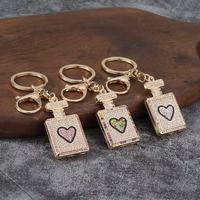 Porte-clés mousqueton en alliage léger et étanche, avec pendentif décoratif en forme de flacon de parfum orné de strass, pour femme, vente en gros, cadeau