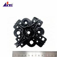 484-0106810-34-02 Plaque de base en plastique noir multi-trous en forme d'étoile NCR pour pièces de rechange de cassette de billets de guichet automatique