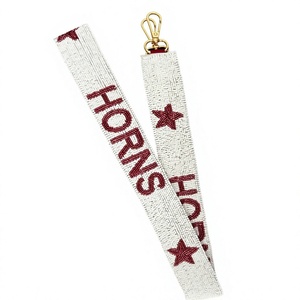 Lanière en polyester tissé blanc avec texte « Cornes Marron » et fermoir mousqueton doré - Product Image 1